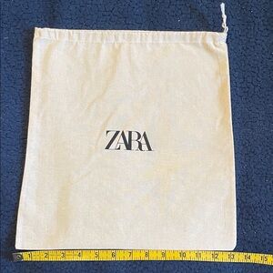 Zara Cream Drawstring Pouch with Black Logo